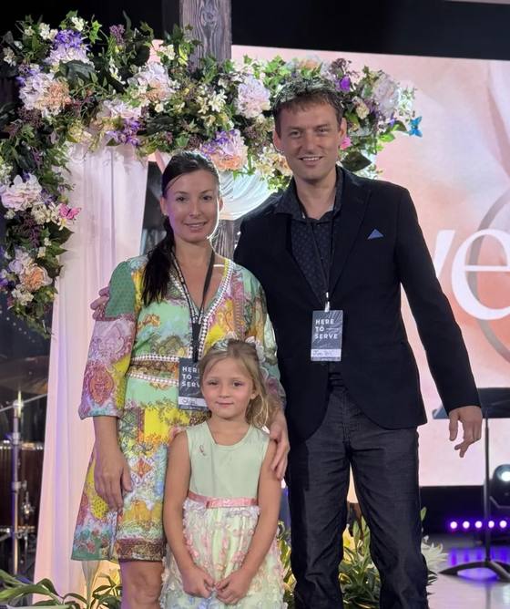 Jim, Olga and Olivia Blackburn volunteering at church